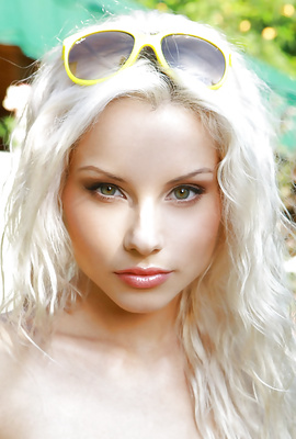 Skinny sexy curly blonde teenie nude at her garden