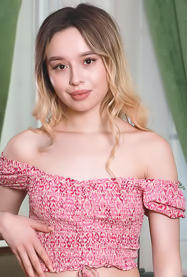 /Mia Lamb Sits With Her Silky Thighs Parted To Frame Her Shaved Pussy