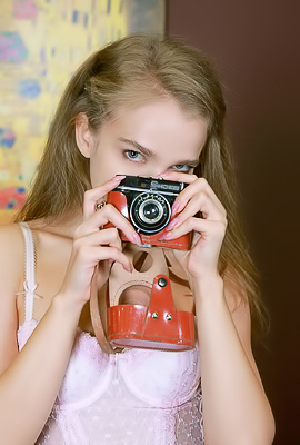 Xenia Glancing Back Over Her Shoulder With A Flirtatious Smile