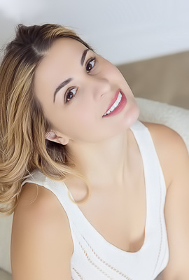 Alice Kelly Dark-eyed Siren Smiles Enticingly As The Straps Slide From Her Shoulders